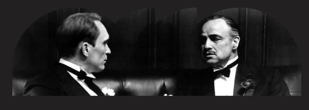 Two men in conversation — the original consigliere